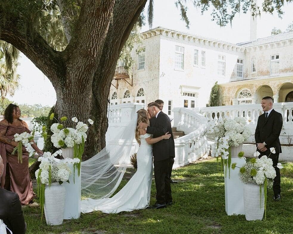 The stage is set at Bella Cosa in Lake Wales with these modern white and green florals